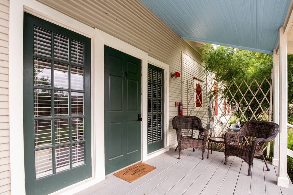 The perfect spot for your morning coffee, the private front porch offers welcoming patio furniture.