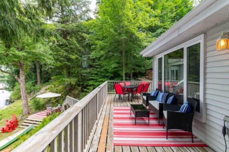 Enjoy your meals outdoors on the spacious deck, surrounded by stunning lake view