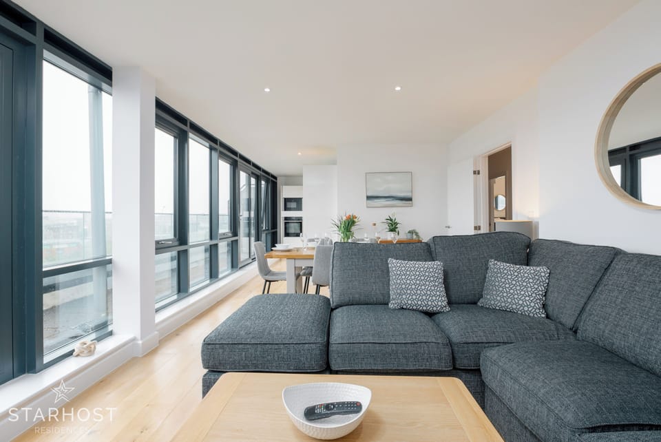 The living room gives access to the balcony which provides a city view