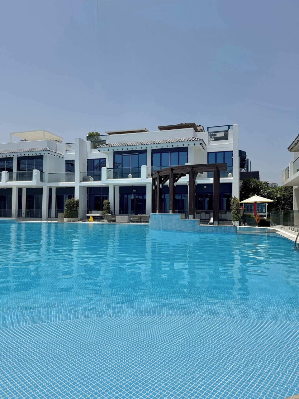Beautiful and large climate controlled communal pool with separate jacuzzi and kids areas