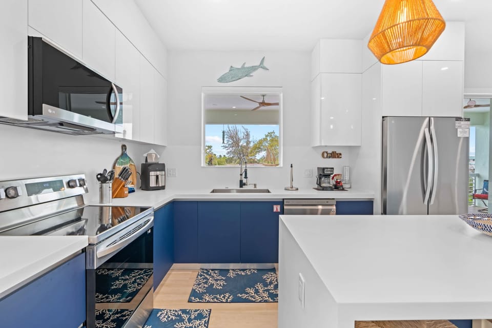 Create culinary masterpieces in the fully equipped kitchen featuring modern appliances and ample counter space.