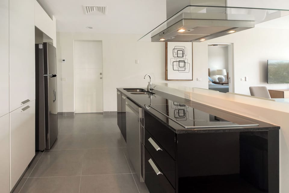 Sleek and pristine, our kitchen space offers updated appliances for your convenience.