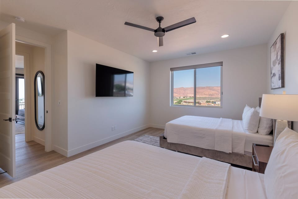 Bedroom 4 - Bedroom 4 is a large bedroom which includes two queen beds, closet and private TV.