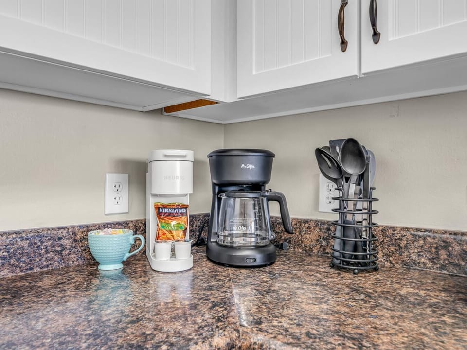 Wake up to fresh coffee brewing in your well-equipped kitchen, with everything ready for your perfect morning routine.