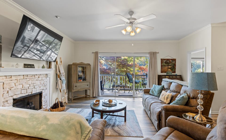 Spacious family room, big screen TV, gas fireplace and perfect views of the lake