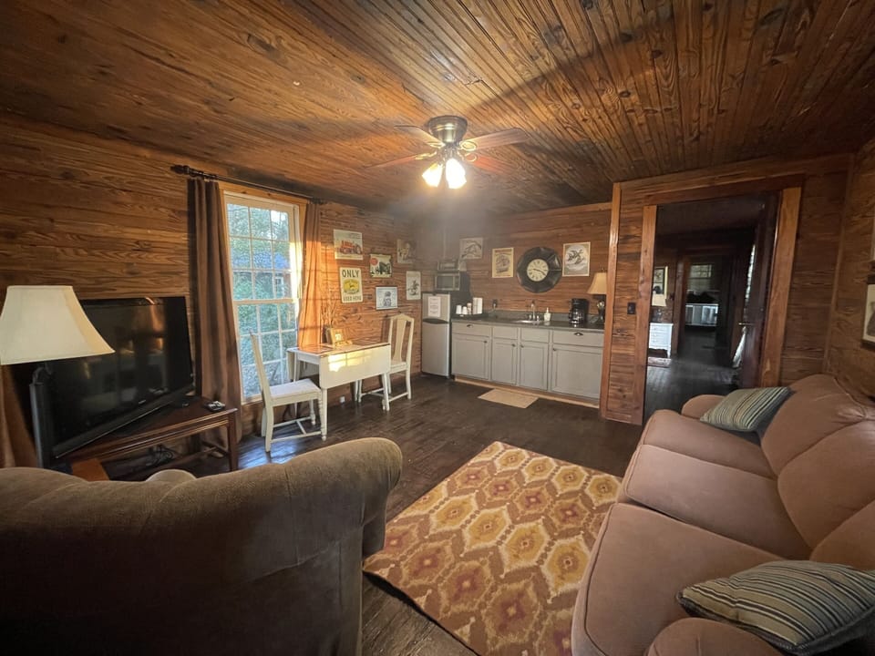 Living area/kitchenette includes mini fridge, microwave & toaster oven