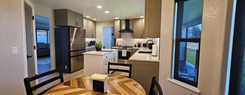 Samsung appliances, gas stove, refrigerator with built in ice and water center.