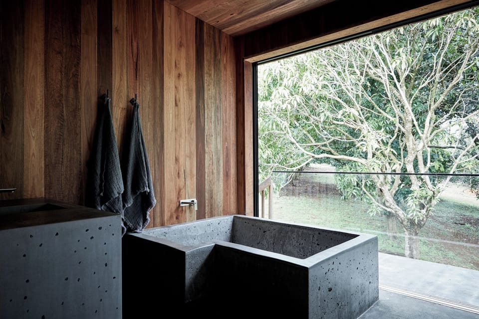 Bespoke concrete bath overlooking the orchard