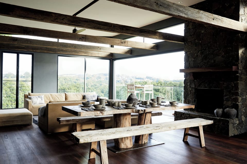 The living room complete with stone fireplace and Tuscan-like views.