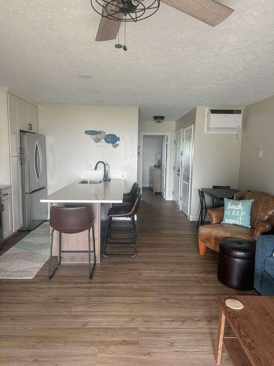 kitchen and hallway to primary bedroom