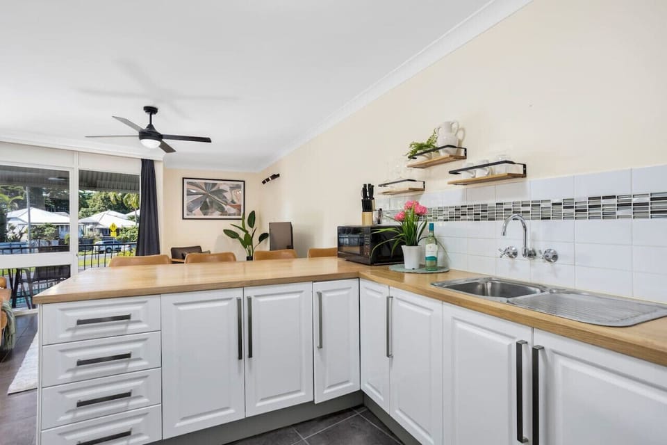 Kitchen: Bright and functional space with modern appliances and natural light for culinary adventures!