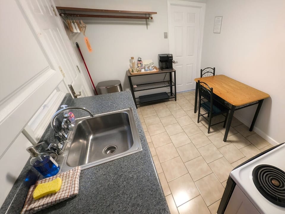 Small space, big convenience! Our modern kitchenette is fully equipped with a microwave, mini-fridge, and all the essential cookware for a quick and easy meal.