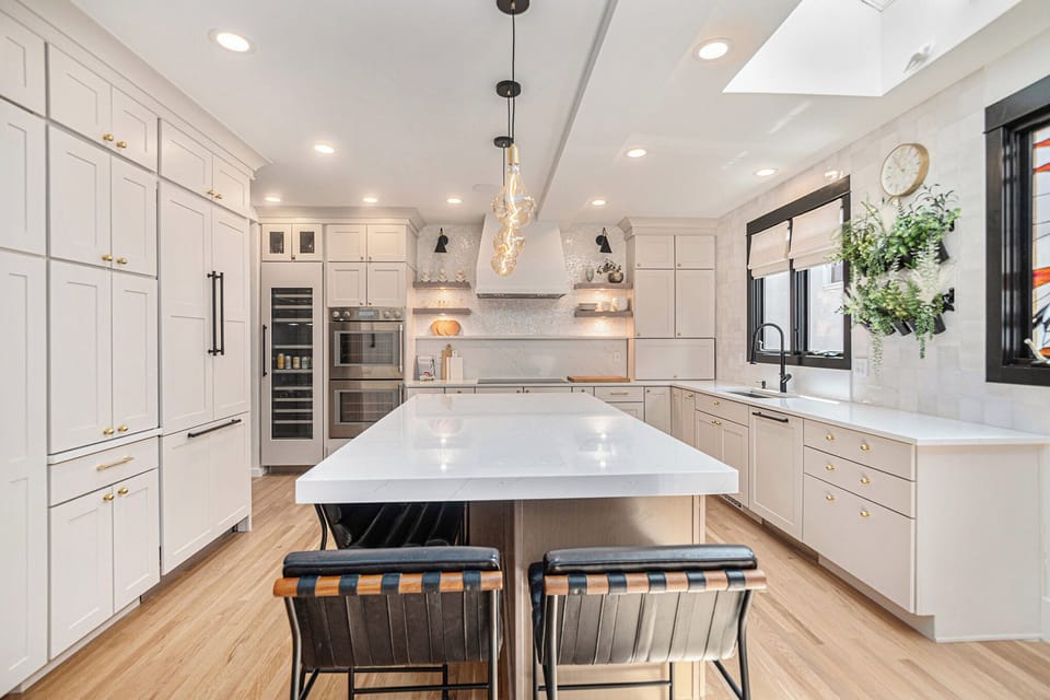 - Cook and gather in this stunning kitchen with a large island and dual seating
- Integrated appliances, open shelving, and soft lighting create a modern farmhouse feel
- Plenty of counter space makes entertaining a breeze for any group