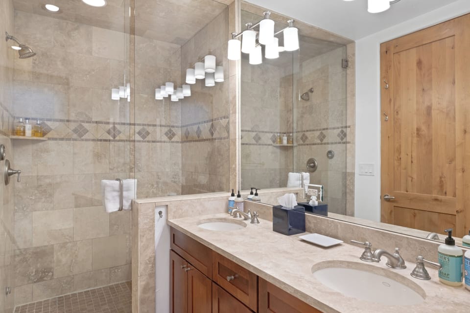 Bathroom 1 - Primary Bathroom - Ensuite bathroom with double vanity and walk-in steam shower