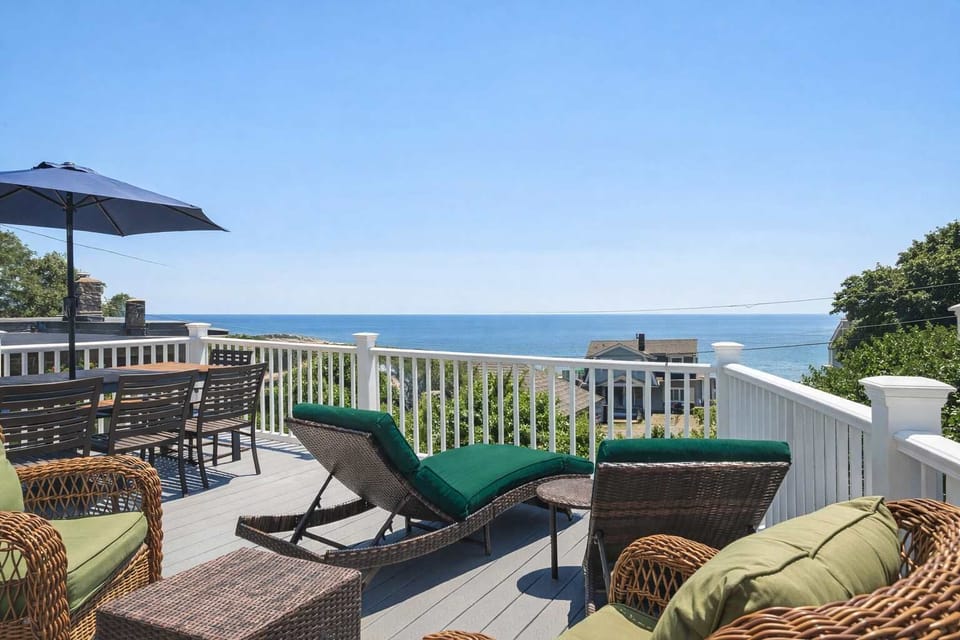 Expansive deck with seating, shade, and endless ocean views