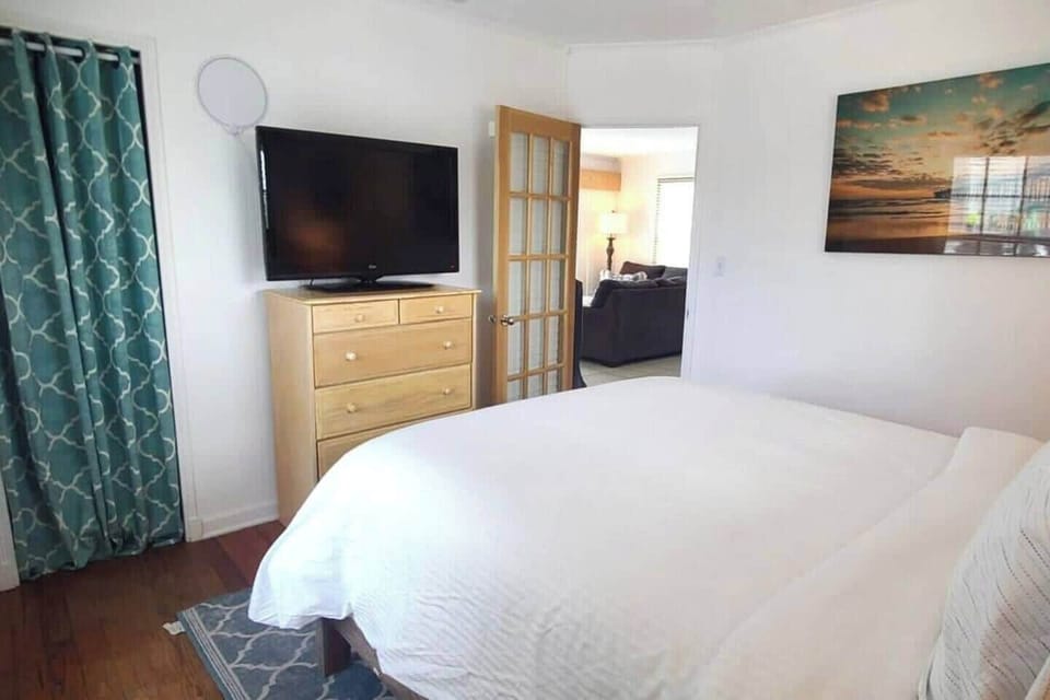Queen bed with TV