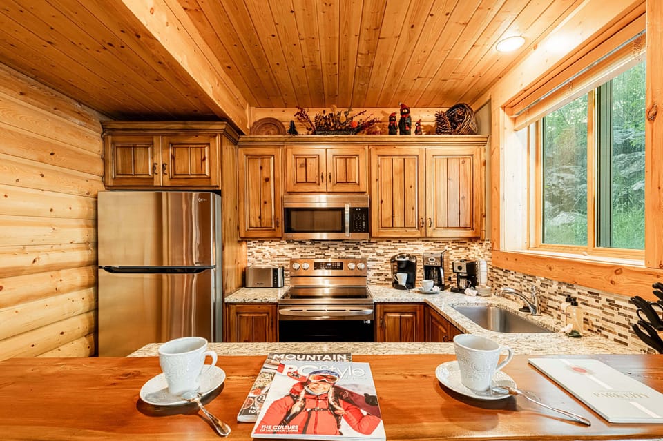 Fully equipped kitchen and bar seating for three