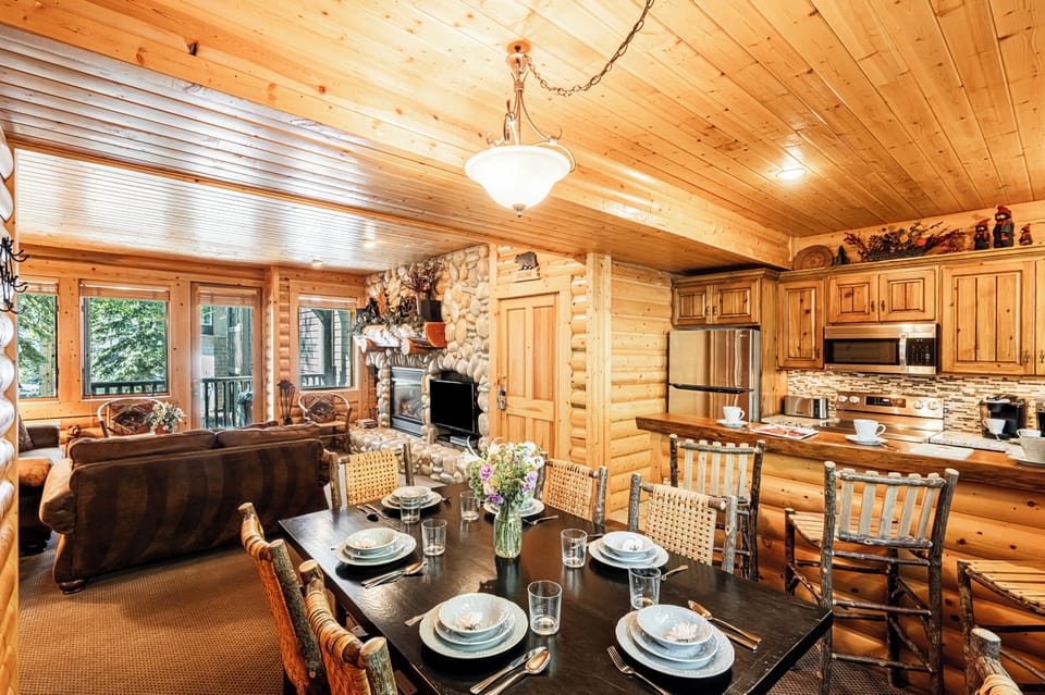 Dining area with seating for six and a closet with a stacked washer/dryer