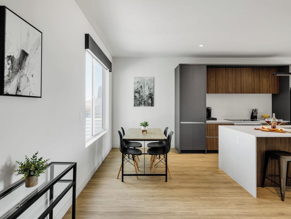 Unit 1 (1st Floor): Fully equipped modern kitchen completely stocked with all culinary essentials and includes high-end Cafe stainless steel appliances. Dining table offers a space for four.