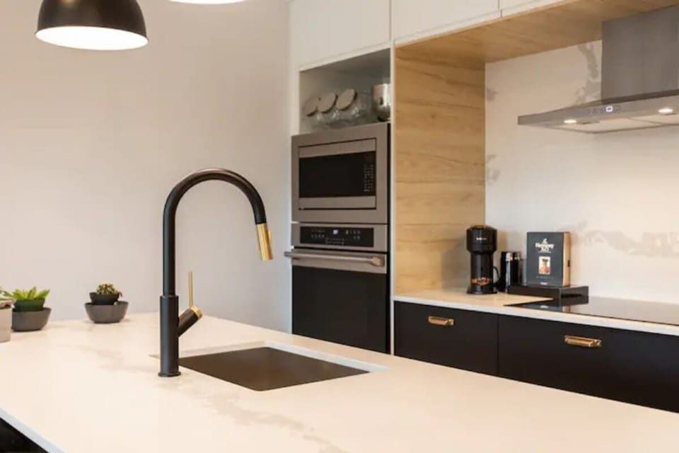 Sleek white modern sink with a stylish faucet for a clean, contemporary touch.