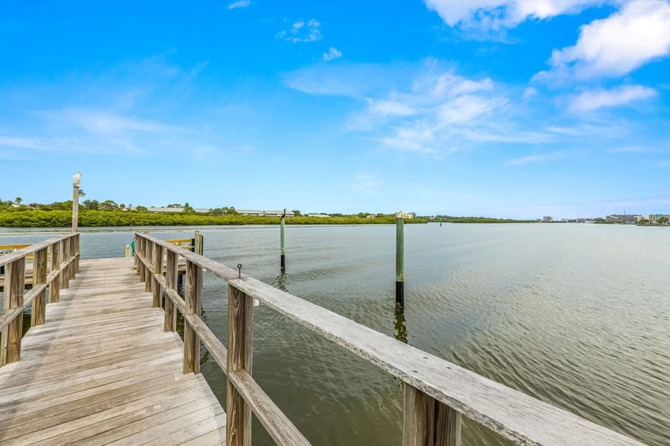 Take in the calm of the bay, highlighted by a wooden pier extending into the water