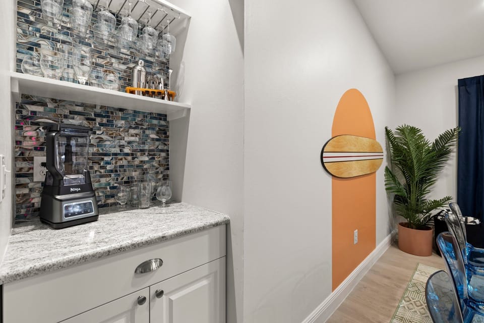 Sip and dine in style with our sleek bar area adjacent to the dining space