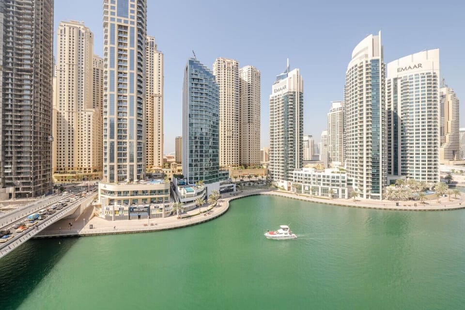 Spacious balcony in Marina View Tower B's 1-bedroom apartment, offering elegant outdoor seating and mesmerizing waterfront views of Dubai Marina's skyline. An excellent choice for a holiday home, vacation rental, or short-term rental in Dubai Marina.