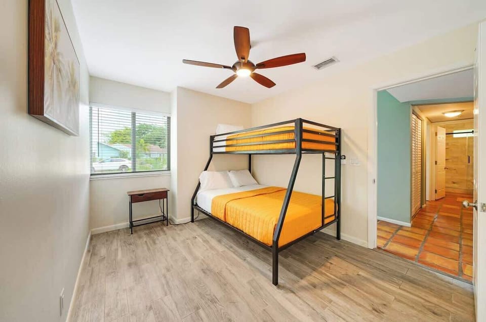 The bunk bed setup maximizes floor space while offering comfortable sleeping arrangements. 