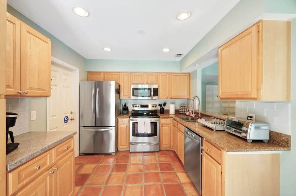 Our fully equipped kitchen features modern appliances, including a refrigerator, stove, oven, microwave, and dishwasher, as well as a variety of cooking utensils and cookware.  