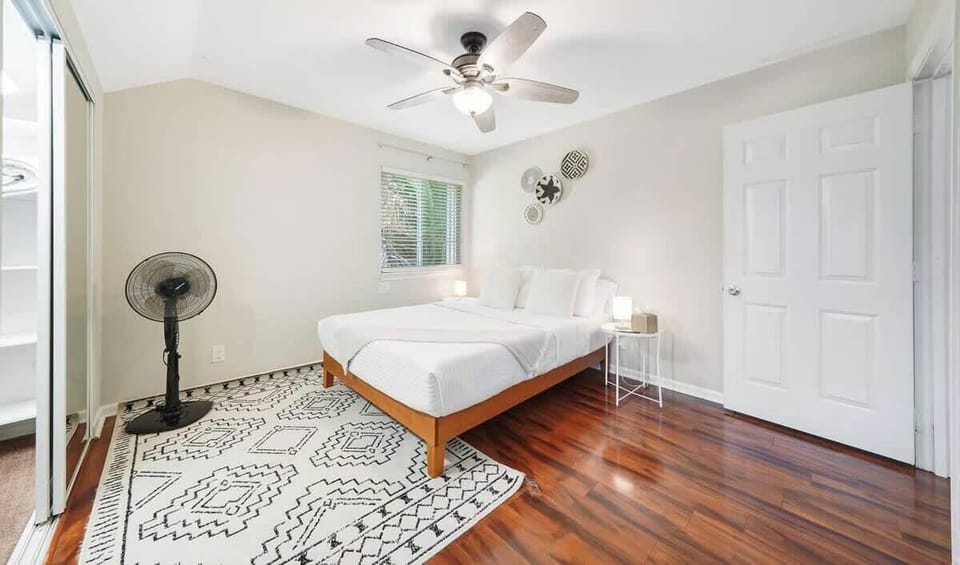 Our bedroom with a queen bed offers a cozy retreat designed for comfort and relaxation. The room is tastefully furnished with soft linens, plush pillows, and stylish decor to create a serene atmosphere. 