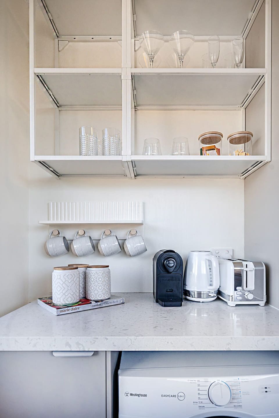 Enjoy a fully-equipped kitchen with washer, dryer, oven and dishwasher for seamless living.