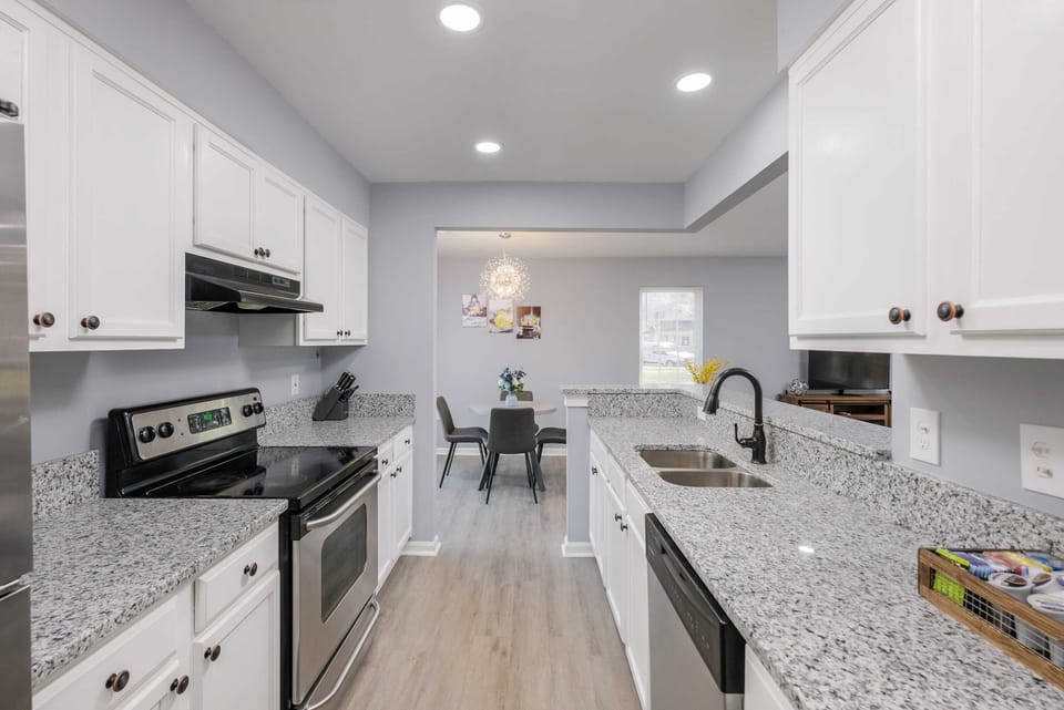 Open layout kitchen and eating area keep everyone together. Cook and relax in one central space. 