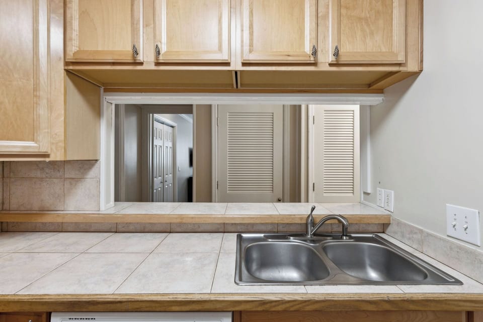 Nostalgic pass-through design of the kitchen is a fun way to reconnect through generations