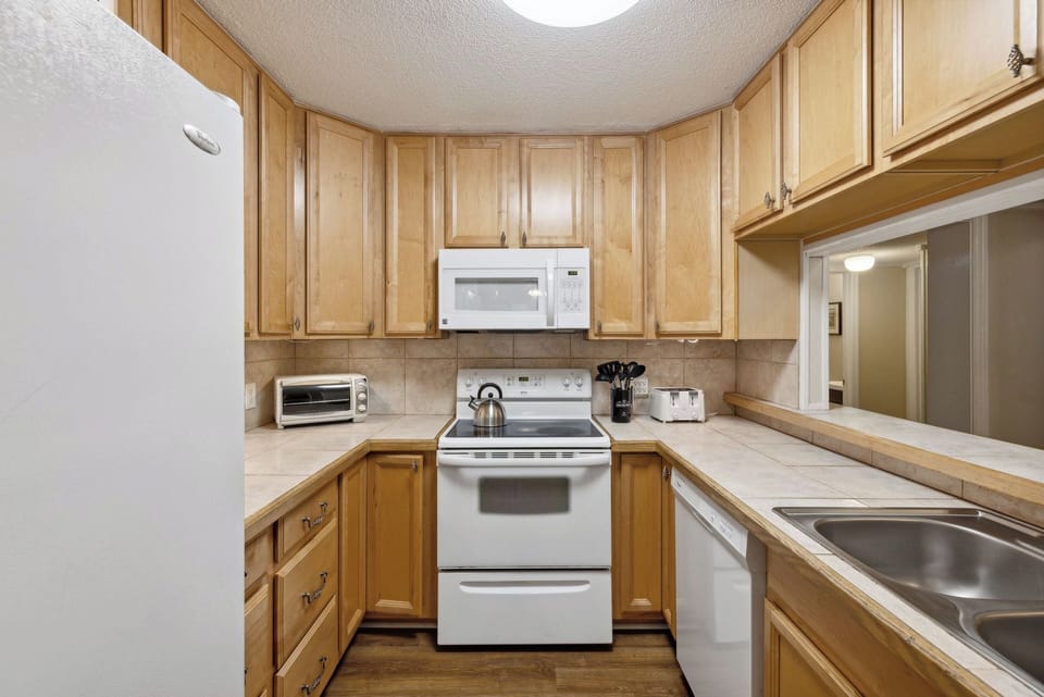 Kitchen is equipped with everything necessary to cook and serve basic meals