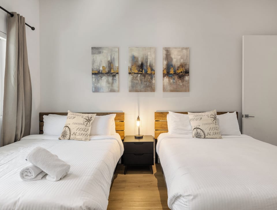 Unit 1 - 2nd Floor: 2nd Bedroom featuring 2 Queen Beds, a Smart TV, and an ensuite bathroom.