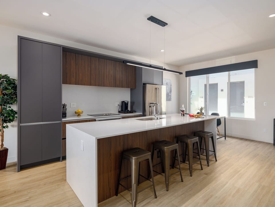Unit 1 - 1st Floor: Fully equipped modern kitchen completely stocked with all culinary essentials and includes high-end Cafe stainless steel appliances.