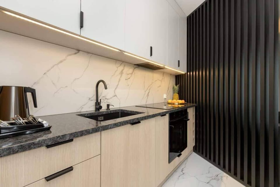 Bright kitchen with cooking utensils. 