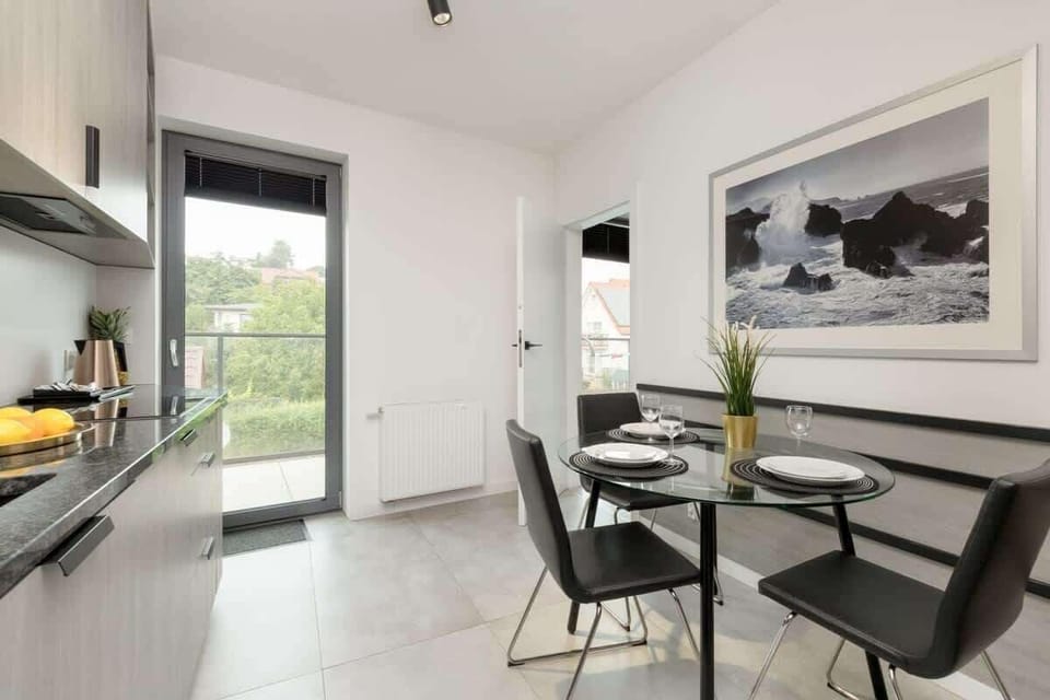 Kitchenette with plenty of kitchen utensils and dishes. 