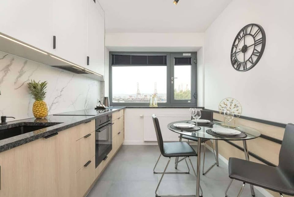 Bright kitchen with cooking utensils. 