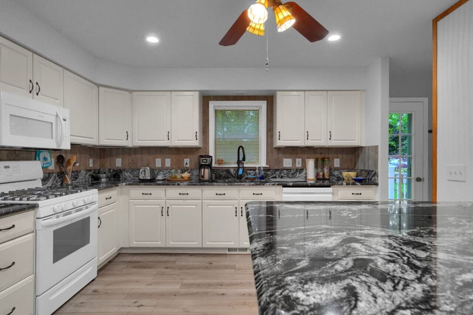 Another view of the kitchen with unique and gorgeous countertops