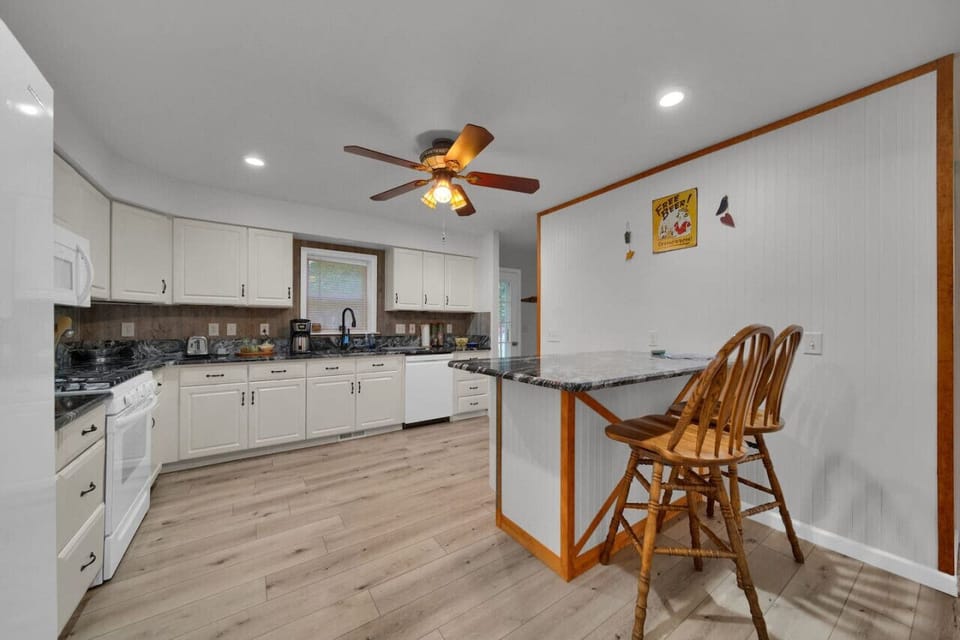 Kitchen area with seating at the island to enjoy time with friends and family