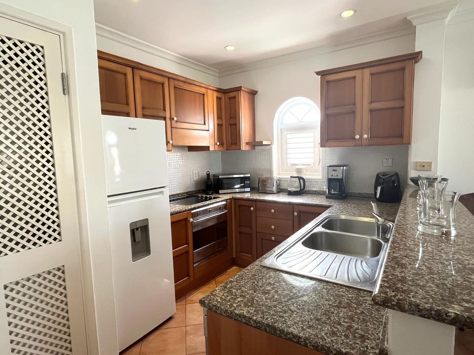 Kitchen at Palm Breeze - fully equipped