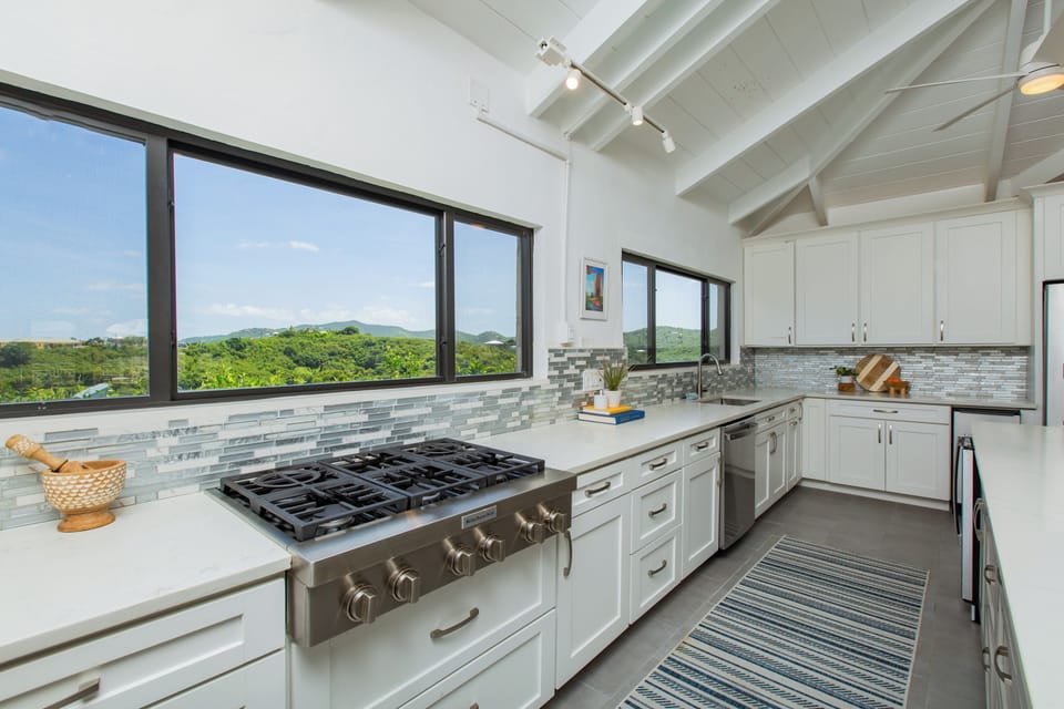 Upstairs kitchen with 6 burner gas stove.