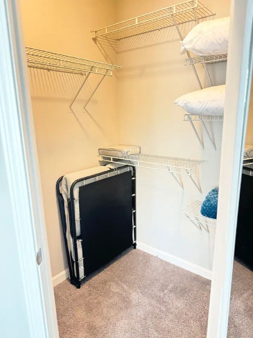 2nd bedroom with two full beds, TV and extra linen and roll-away twin bed