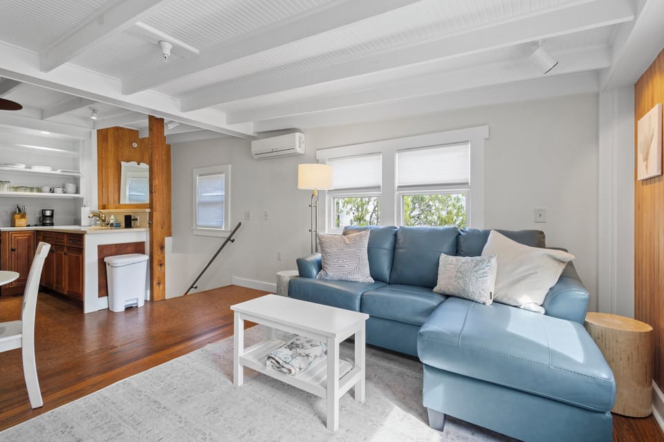 The interior staircase leads directly into the kitchen and living room.