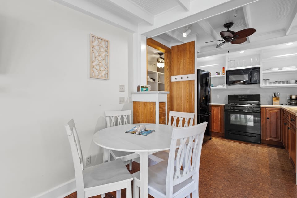 Enjoy a meal in the dining area situated between the living room and kitchen.