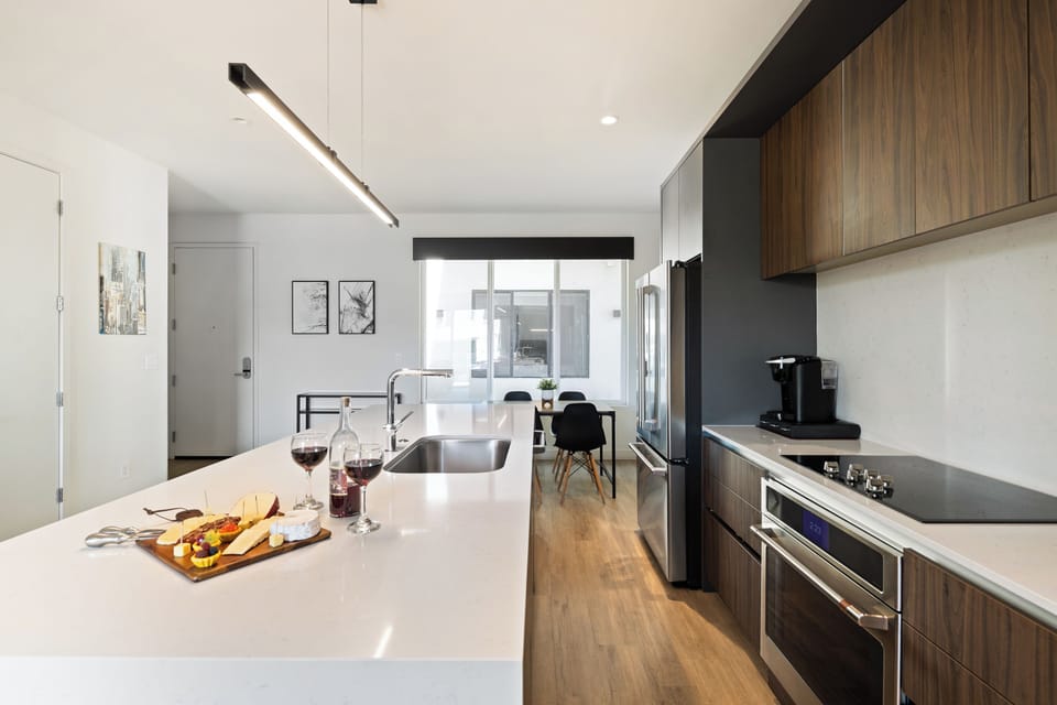 1st Floor: Fully equipped modern kitchen completely stocked with all culinary essentials and includes high-end Cafe stainless steel appliances.