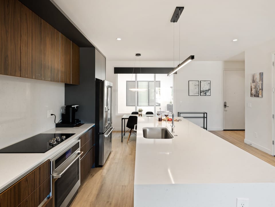 1st Floor: Fully equipped modern kitchen completely stocked with all culinary essentials and includes high-end Cafe stainless steel appliances.