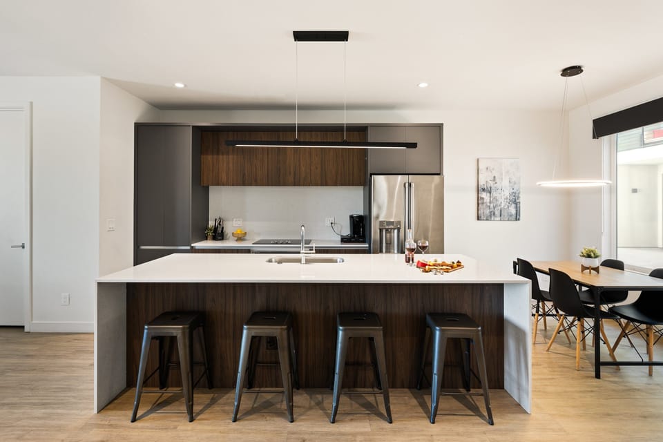 1st Floor: Fully equipped modern kitchen completely stocked with all culinary essentials and includes high-end Cafe stainless steel appliances.