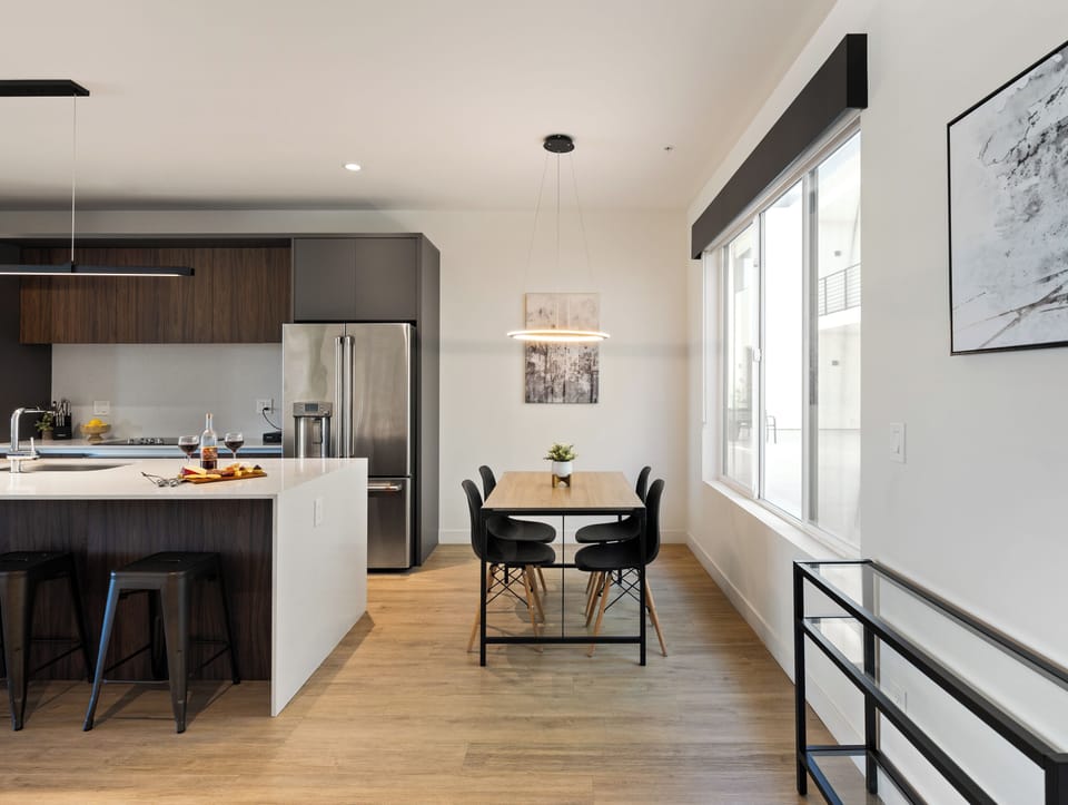 1st Floor: Fully equipped modern kitchen completely stocked with all culinary essentials and includes high-end Cafe stainless steel appliances. Dining table offers a space for four.